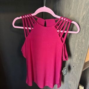 Small maroon red shirt. Fits like a medium.